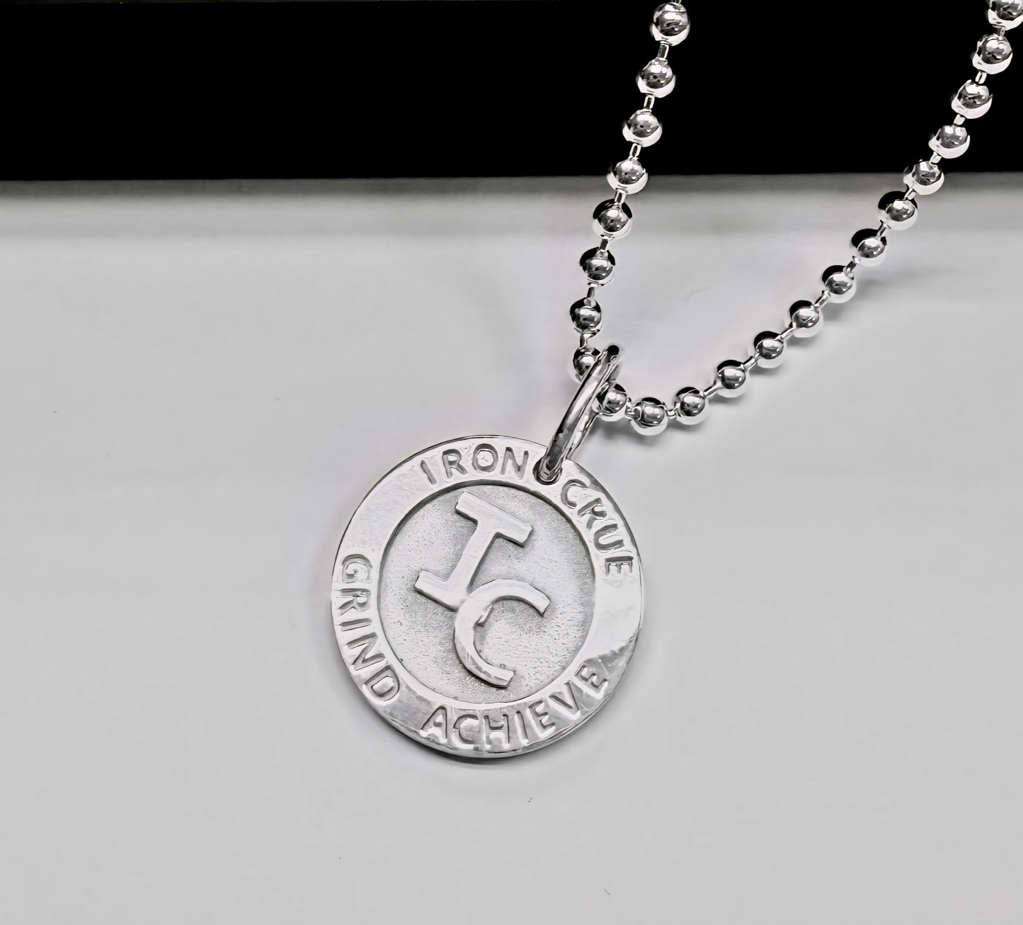 Signature Round Iron Crue Sterling Silver Pendant